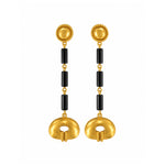 A pair of gold and black drop earrings with textured circular gold tops, black cylindrical beads, and oval gold pendants, shown on a plain white background.