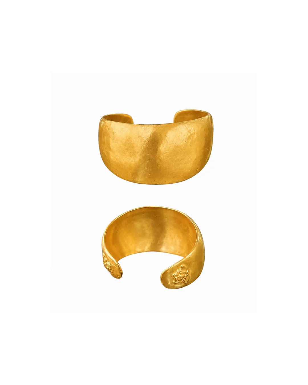 Two textured gold cuff bracelets shown on a plain white background, one above the other.
