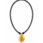 A minimalist gold pendant necklace on a black multi-strand cord, shown against a plain white background.