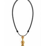 A gold pendant necklace with a small, ornate gold vase-shaped pendant hanging from a black cord on a solid white background.