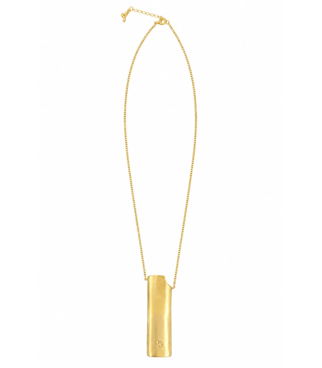 A gold pendant necklace featuring a vertical rectangular bar pendant on a delicate gold chain, shown against a plain white background.